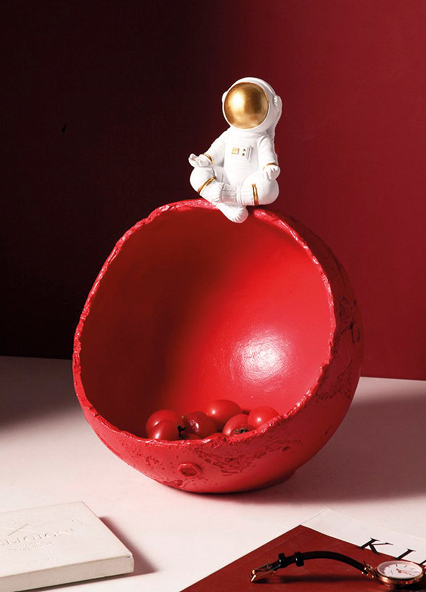 Figura de resina astronauta con cuenco bol rojo